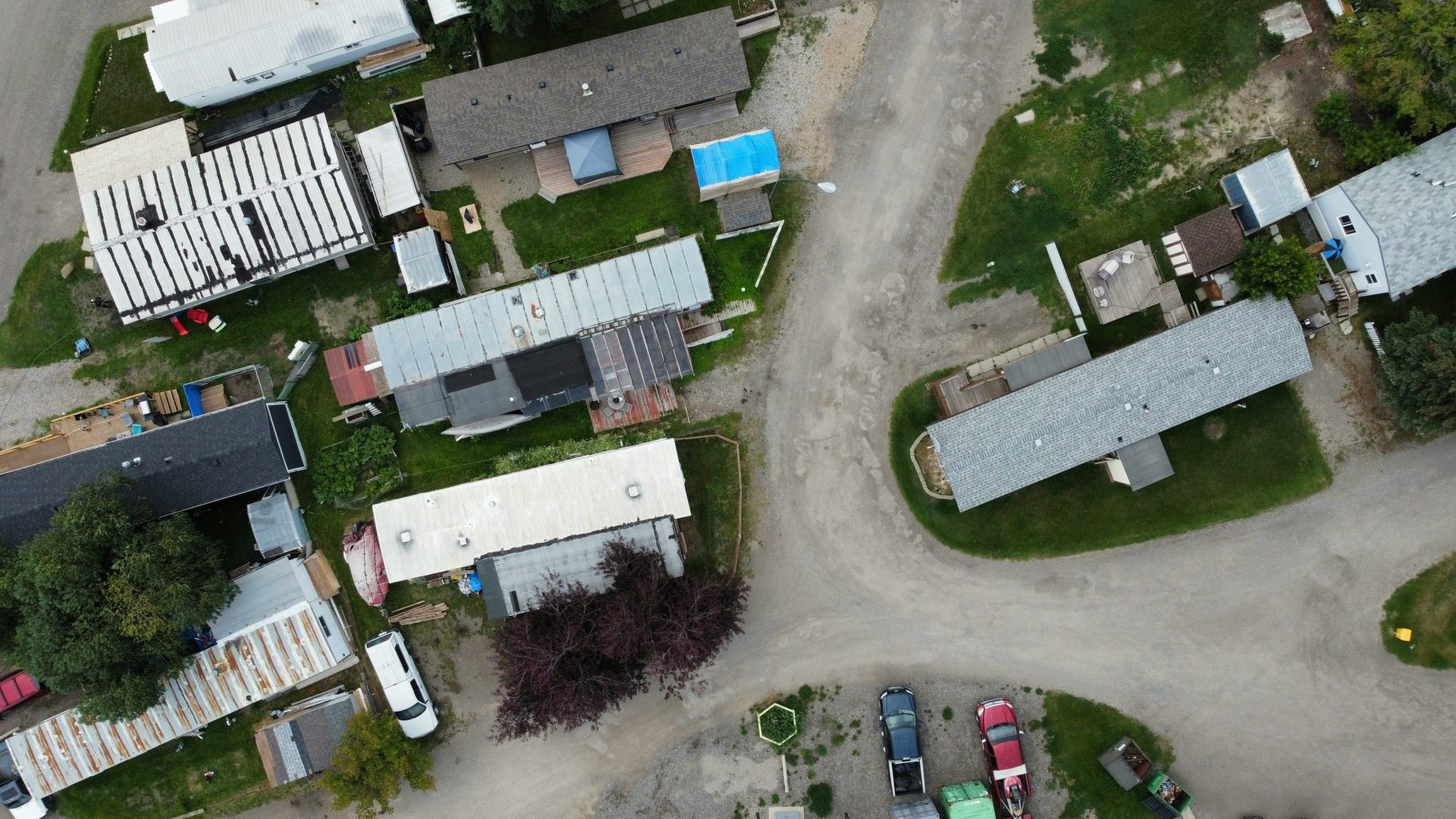 Aerial view of a trailer park with multiple homes.